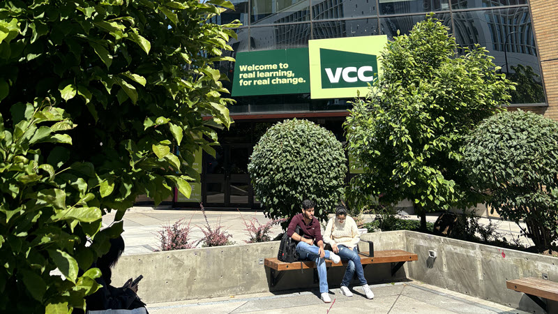 Exterior view of the VCC building, featuring a green sign with the VCC logo and the text